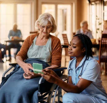 nurse and elderly woman receiving care